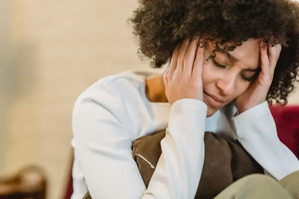 Adult experiencing emotional distress — representing conditions we treat with compassionate care